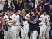 Cleveland Indians fans applaud the fans after the ninth inning of a baseball game against the Kansas City Royals, Friday, Sept. 15, 2017, in Cleveland.