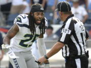 Seattle Seahawks cornerback Richard Sherman (25) argues a penalty call with umpire Paul King (121) in the first half of an NFL football game against the Tennessee Titans Sunday, Sept. 24, 2017, in Nashville, Tenn.