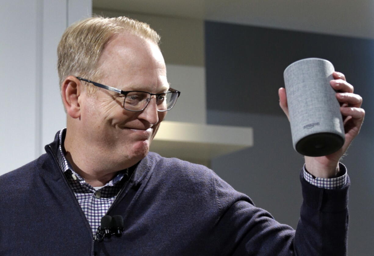 David Limp, senior vice president of Devices and Services at Amazon, smiles as he displays a new Amazon Echo during an event announcing several new Amazon products by the company, Wednesday, Sept. 27, 2017, in Seattle. Amazon says it is cutting the price of its Echo smart speaker, improving the sound quality and upgrading its appearance with six new “shells.” The next generation speaker, which is powered by Amazon’s Alexa voice assistant, will have a dedicated woofer and a tweeter for the first time, as well as Dolby sound.