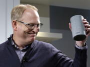 David Limp, senior vice president of Devices and Services at Amazon, smiles as he displays a new Amazon Echo during an event announcing several new Amazon products by the company, Wednesday, Sept. 27, 2017, in Seattle. Amazon says it is cutting the price of its Echo smart speaker, improving the sound quality and upgrading its appearance with six new “shells.” The next generation speaker, which is powered by Amazon’s Alexa voice assistant, will have a dedicated woofer and a tweeter for the first time, as well as Dolby sound.