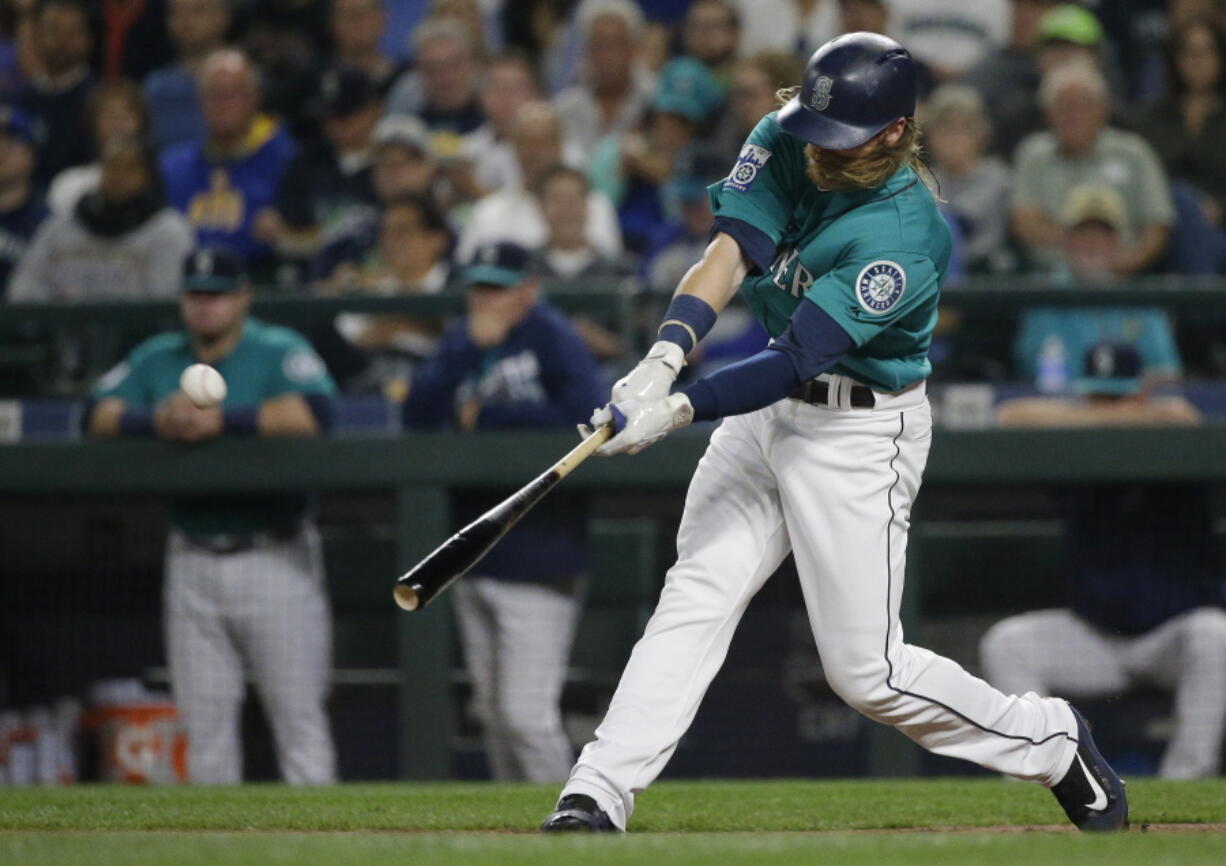 Seattle Mariners’ Ben Gamel hits a three-run home run against the Los Angeles Angels during the second inning of a baseball game, Friday, Sept. 8, 2017, in Seattle. (AP Photo/Ted S.