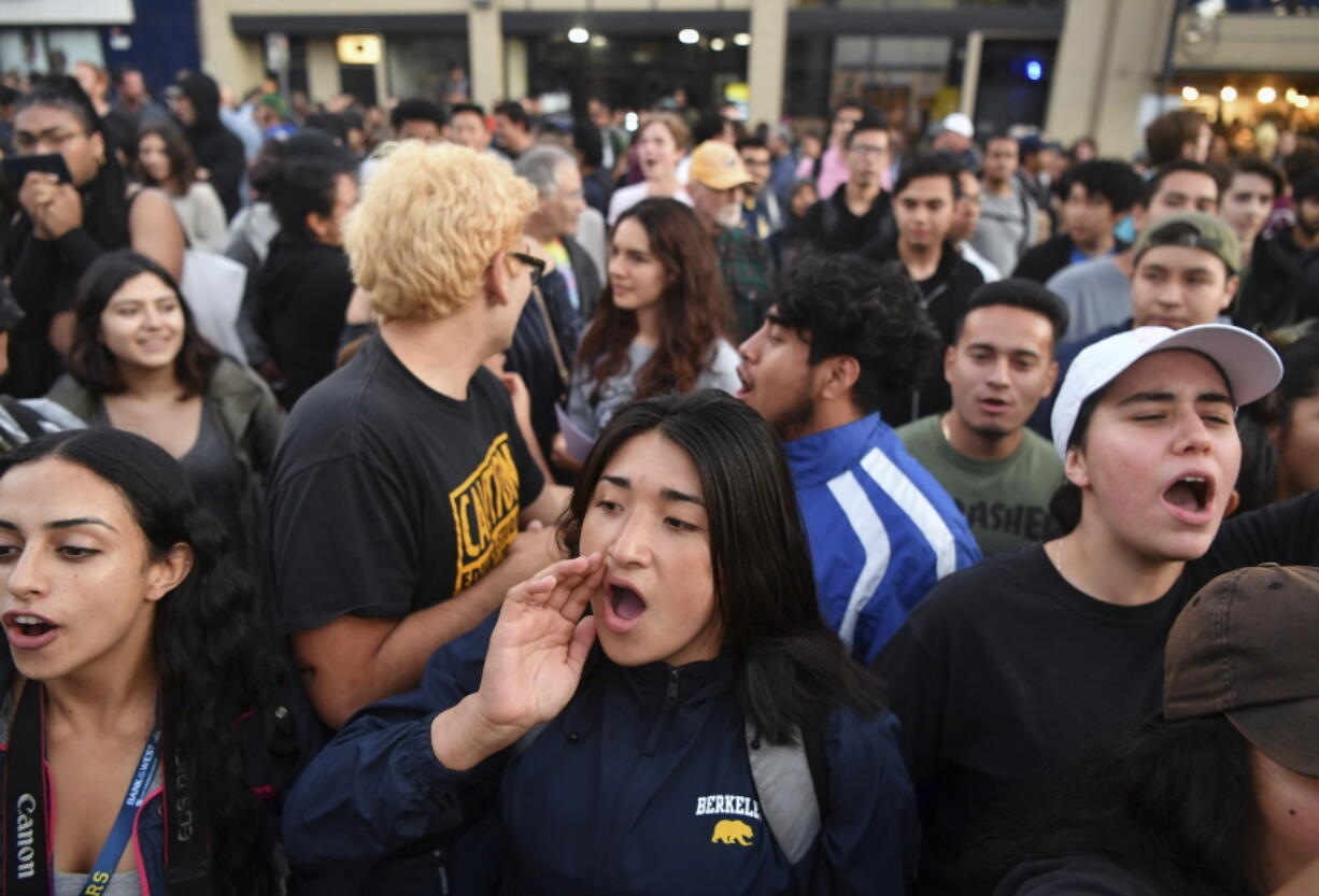 Protesters shout before a speaking engagement by Ben Shapiro on the campus of the University of California Berkeley in Berkeley, Calif., on Thursday. Several streets around the University of California, Berkeley, were closed off Thursday with concrete and plastic barriers ahead of an evening appearance by the conservative commentator - the latest polarizing event to raise concerns of violence on the famously liberal campus.