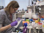 Post doctoral fellow Leslie Mitchell works in April at a New York University lab in the Alexandria Center for Life Sciences in New York, where researchers are attempting to create completely man-made, custom-built DNA.