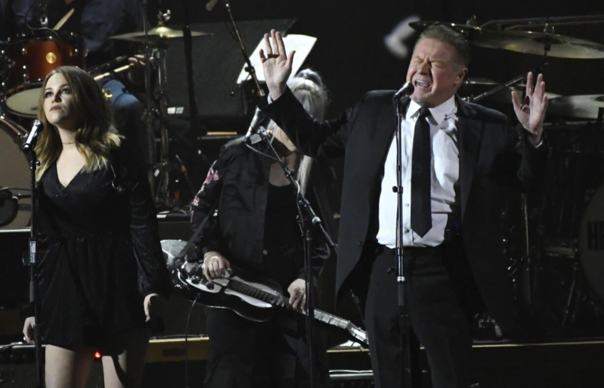 Don Henley performs “Free Fallin” at the MusiCares Person of the Year tribute at the Los Angeles Convention Center. Henley, Lyle Lovett and Clint Black are the latest musicians planning a concert to raise money for victims of Harvey. The trio on Tuesday, Sept. 19 announced a Nov. 28 show at Bass Hall in Fort Worth, Texas.