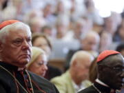 Cardinals Gerhard Ludwig Mueller, left, and Robert Sarah attend a conference on the Latin Mass at the Pontifical University of St. Thomas Aquinas in Rome.