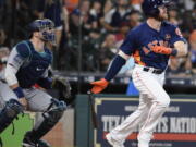 Houston Astros’ Derek Fisher watches his two-run home run off Seattle Mariners starting pitcher Andrew Moore during the fifth inning of a baseball game, Sunday, Sept. 17, 2017, in Houston.