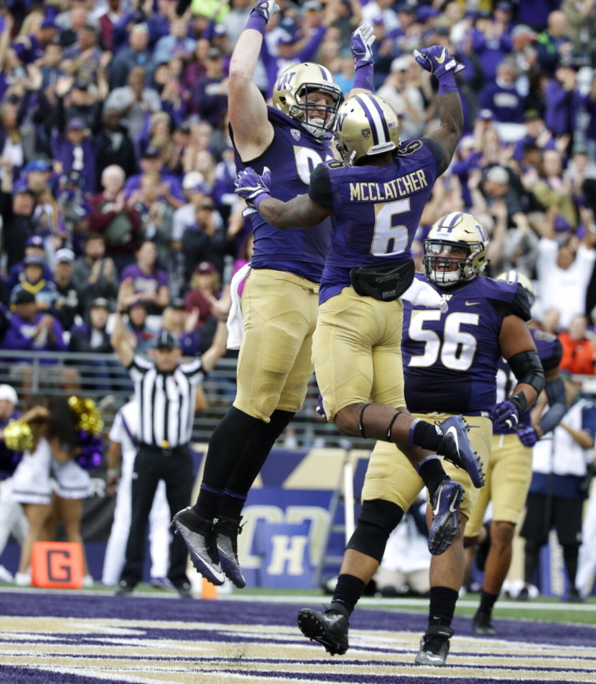 Washington tight end Will Dissly , left, celebrates with wide receiver Chico McClatcher (6) after Dissly caught a pass for a touchdown against Montana in the first half of an NCAA college football game, Saturday, Sept. 9, 2017, in Seattle. (AP Photo/ Ted S.