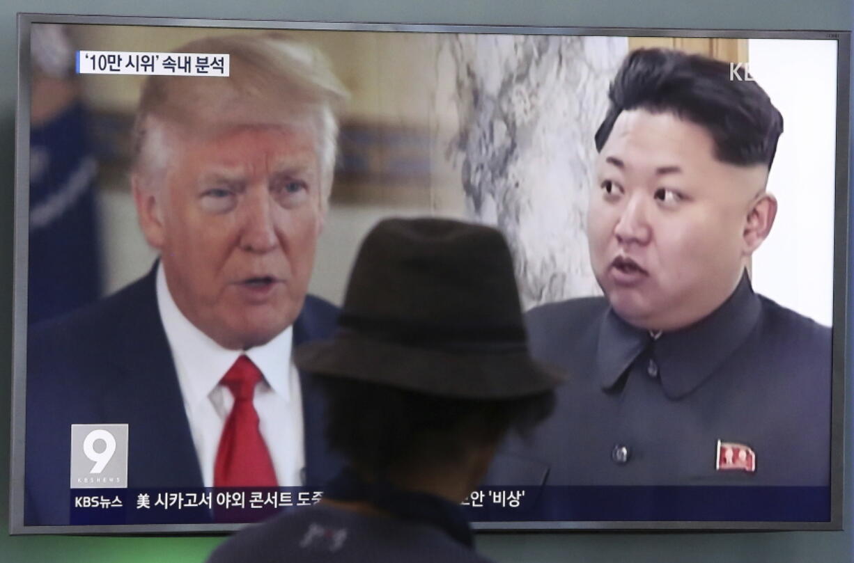 A man watches a television screen showing U.S. President Donald Trump and North Korean leader Kim Jong Un during a news program at the Seoul Train Station in Seoul, South Korea. North Korea said Monday, Sept. 11, 2017 it will make the United States pay a heavy price if a proposal Washington is backing to impose the toughest sanctions ever on Pyongyang is approved by the U.N. Security Council this week.