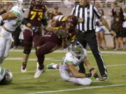 Arizona State running back Demario Richard (4) scores a touchdown over Oregon linebacker Troy Dye during the second half of an NCAA college football game, Saturday, Sept. 23, 2017, in Tempe, Ariz.