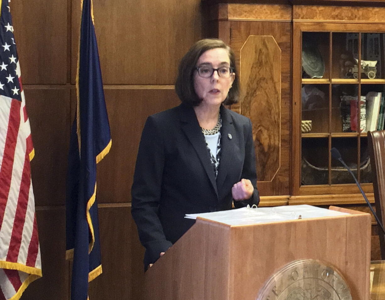 Oregon Gov. Kate Brown speaks April 27 in the Capitol ceremonial office in Salem, Ore. Brown formally announced via a press statement and You Tube video Monday that she will run for re-election.