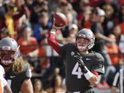 Washington State quarterback Luke Falk (4) throws a pass during the first half of an NCAA college football game against Oregon State in Pullman, Wash., Saturday, Sept. 16, 2017.