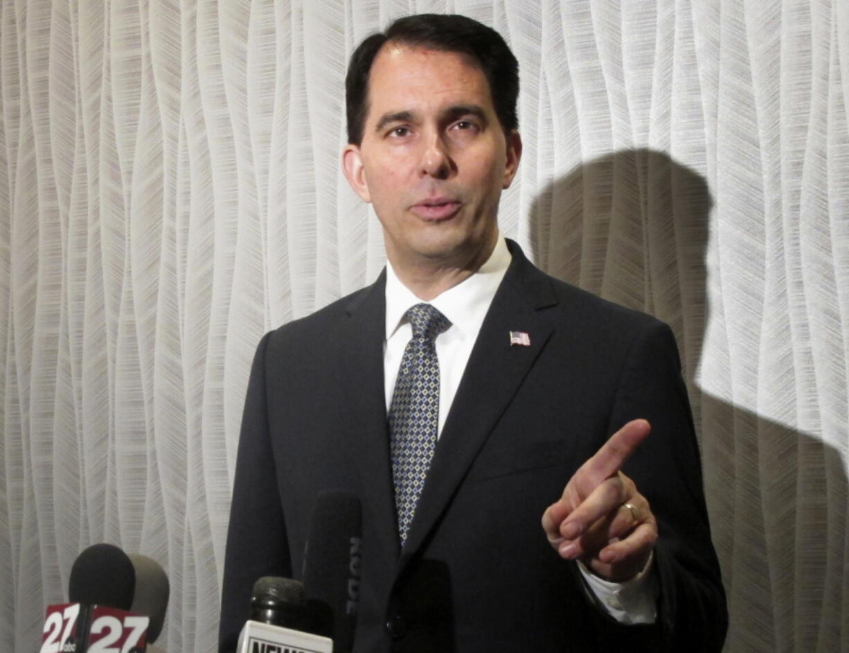 Wisconsin Gov. Scott Walker speaks at a news conference in Madison, Wis. Republican governors have launched a website that appears to be an independent news outlet, but readers have to look carefully to see that The Free Telegraph is the product of a political party committee. The RGA launched the site this summer, but only identified its connection to the site after the Associated Press began inquired. Walker, chairman of the RGA deferred questions through a spokesman to the group’s national staff.