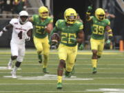 Oregon running back Tony Brooks-James, center, breaks into the open on his way to a touchdown on a kickoff return to start the game against Southern Utah plays in an NCAA college football game Saturday, Sept. 2, 2017, in Eugene, Ore.