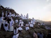 Muslim pilgrims gather Thursday to pray on and around the Jabal Al Rahma holy mountain, or the mountain of forgiveness, at Arafat for the annual hajj pilgrimage outside the holy city of Mecca, Saudi Arabia.