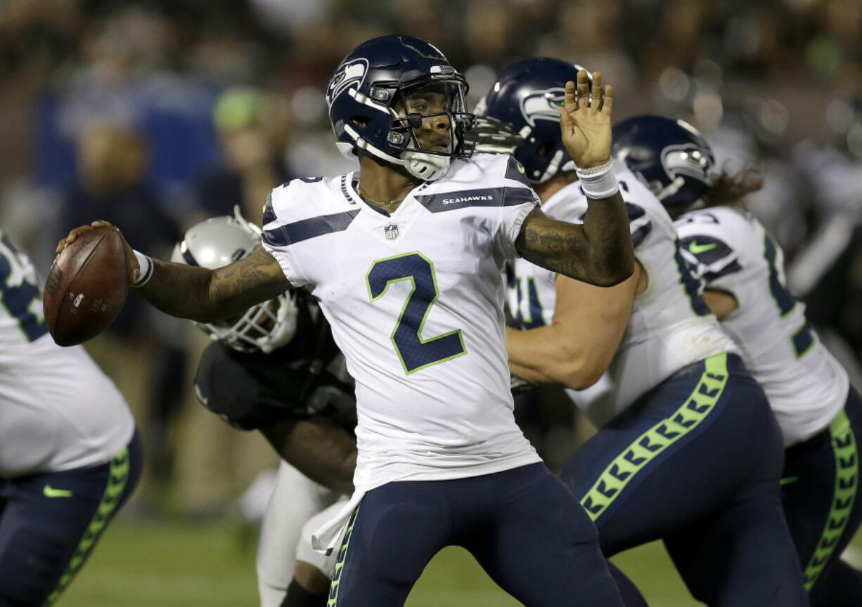 Seattle Seahawks quarterback Trevone Boykin (2) passes against the Oakland Raiders during the first half of an NFL preseason football game in Oakland, Calif., Thursday, Aug. 31, 2017.