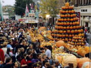 A display of pumpkins shaped like a tree amid crowds at the Circleville Pumpkin Show in Circleville, Ohio. The small town of just 12,000 people south of Columbus attracts tens of thousands of visitors to its free pumpkin festival each October, this year scheduled for Oct. 18-21.