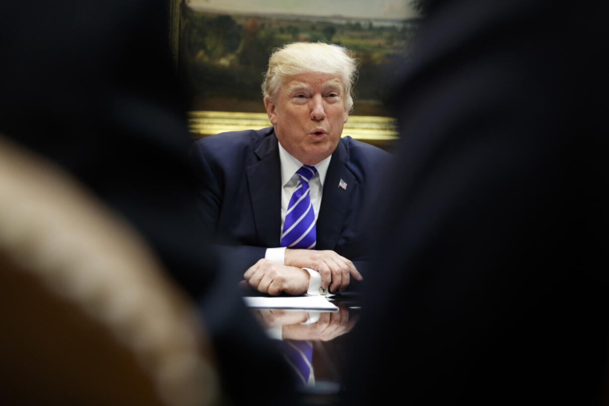 President Donald Trump speaks during a meeting with members of the House Ways and Means committee in the Roosevelt Room of the White House, on Tuesday in Washington.