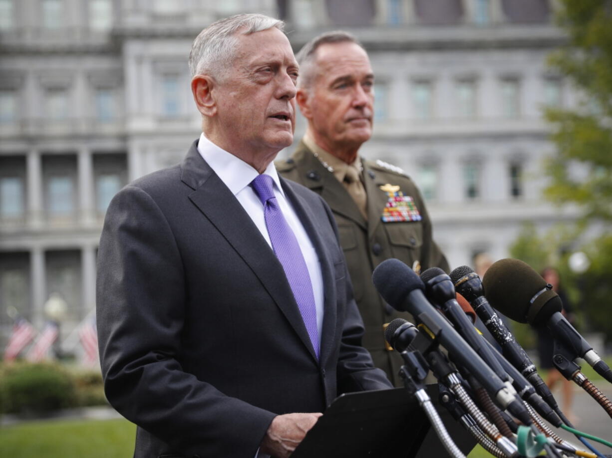 Defense Secretary Jim Mattis, left, accompanied by Joint Chiefs Chairman Gen. Joseph Dunford, right, speaks to members of the media outside the West Wing of the White House in Washington, Sunday, regarding the escalating crisis in North Korea’s nuclear threats.