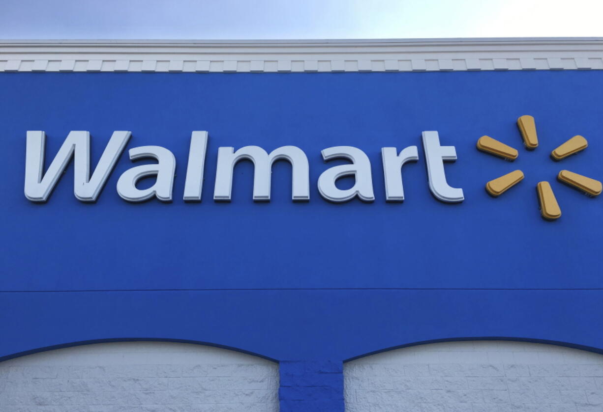 Corporate signage at a Wal-Mart in Kissimmee, Fla. (AP Photo/Swayne B.