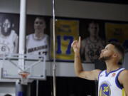 Golden State Warriors’ Stephen Curry poses for photos during NBA basketball team media day Friday, Sept. 22, 2017, in Oakland, Calif.