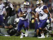 Washington running back Myles Gaskin carries for a long gain against Colorado during the second half of an NCAA college football game Saturday, Sept. 23, 2017, in Boulder, Colo. Washington won 37-10.