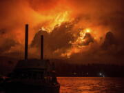 This Monday Sept. 4, 2017, photo provided by KATU-TV shows the Eagle Creek wildfire as seen from Stevenson Wash., across the Columbia River, burning in the Columbia River Gorge above Cascade Locks, Ore. A lengthy stretch of highway Interstate 84 remains closed Tuesday, Sept. 5, as crews battle the wildfire that has also caused evacuations and sparked blazes across the Columbia River in Washington state.