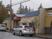 Ridgefield Community Library, center, is seen flanked by two other buildings in downtown Ridgefield.