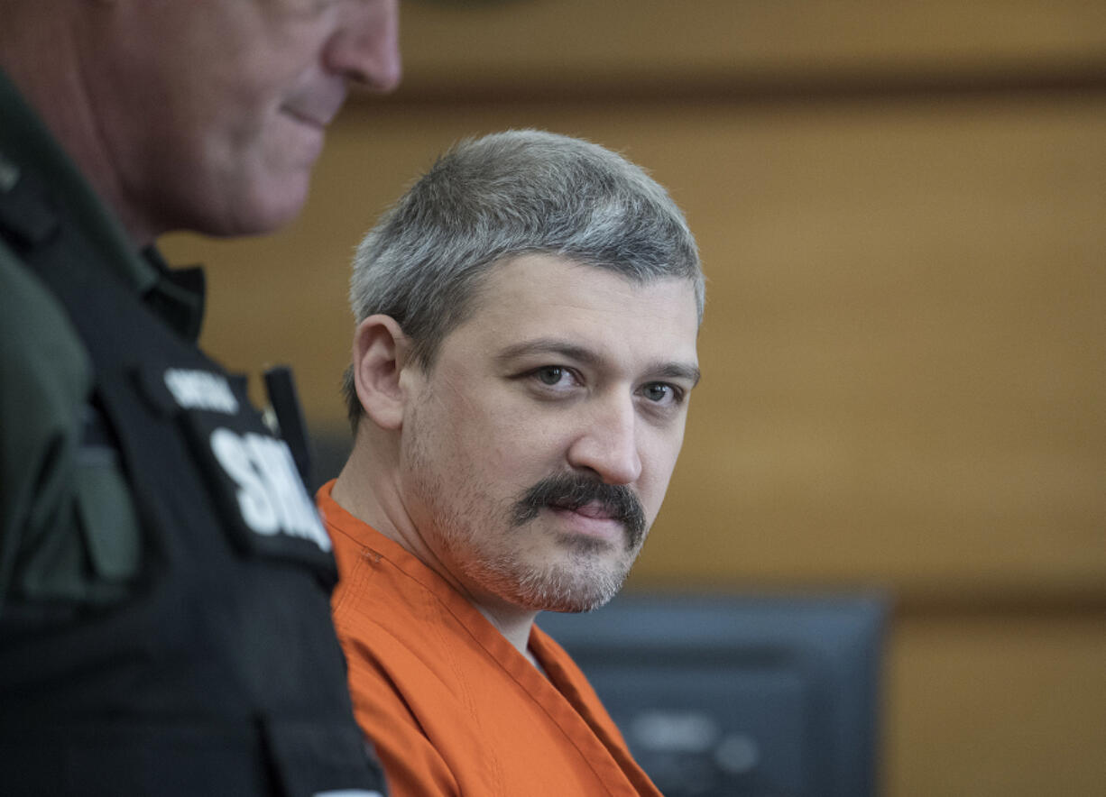 Triple-homicide suspect Brent Luyster makes his way into Clark County Superior Court on Oct. 6 for the attorneys to discuss discovery issues in his case.