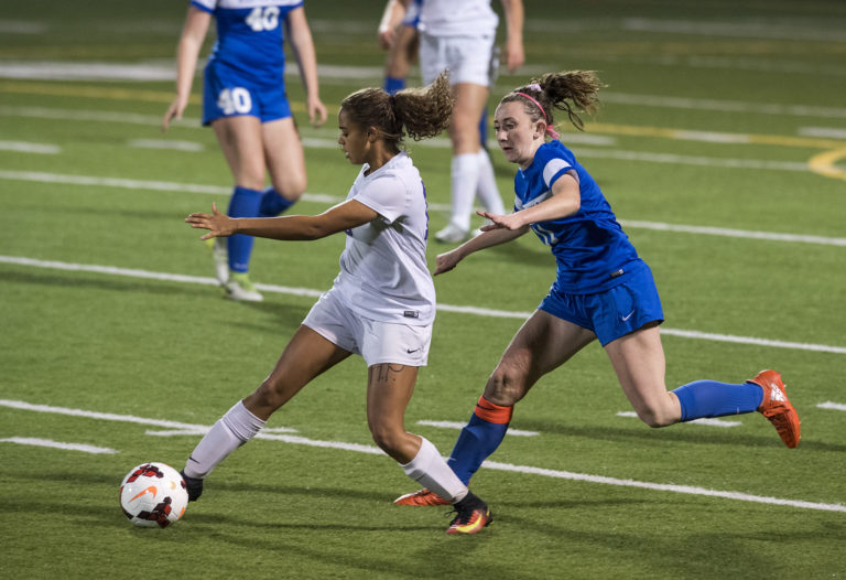 Columbia River's Shalece Easley (16) dribbled past Ridgefiled's Jolie Gullickson (11) during the 2A district semifinals at Kiggins Bowl in Vancouver on Tuesday evening Oct. 31, 2017. The Chieftains won the game 1-0 and will move on to play Hockinson in district finals this Thursday.