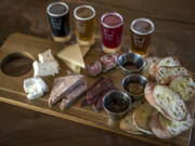 The cheese and meat board is pictured with a selection of beer at Final Draft Taphouse.