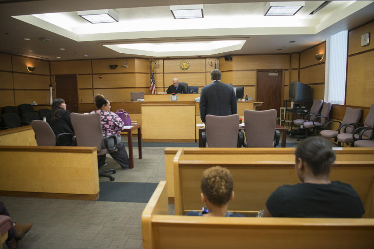 Judge Robert Lewis, top center, oversees the evidentiary hearing of Vancouver resident Charmaine Crossley, second from left. Crossley’s case was continued to Nov. 3.