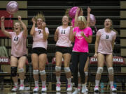 Camas coach Michelle Allen and her players celebrate a point at the end of the third set during Tuesday’s four-set league victory over Union.