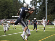 Skyview's Cole Grossman (3) catches the ball for a touchdown as Camas' Isaiah Abdul (2) tries to block him during Friday night's game at Kiggins Bowl in Vancouver on Oct. 6, 2017. Camas defeated Skyview 38-20.