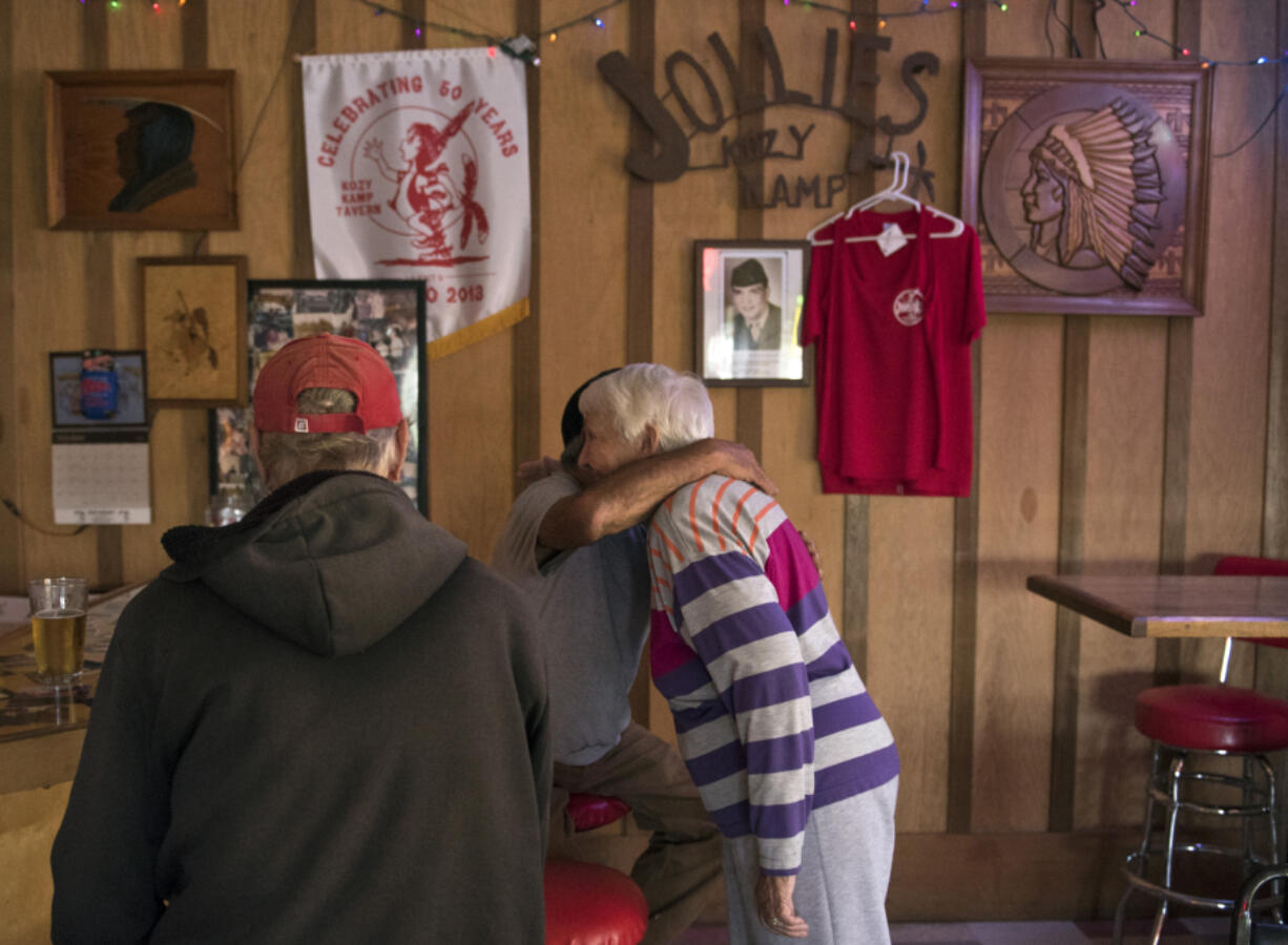 Mike Richardson, of Ridgefield, embraces co-owner Charlene Jollie at Jollie’s Restaurant & Lounge off in Ridgefield on Wednesday. After opening in 1963, the restaurant will close Sunday night.