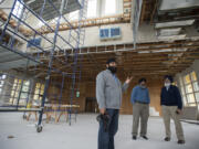 Volunteer spokesman Pawneet Sethi, left, talks about future plans while touring the Guru Ram Dass Sahib Gurdwara with Gurjit Singh and Kamal Bains.