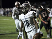 Skyview’s Jalynnee McGee (15) turns back to celebrate with his team after scoring a touchdown during Thursday win over at Battle Ground.