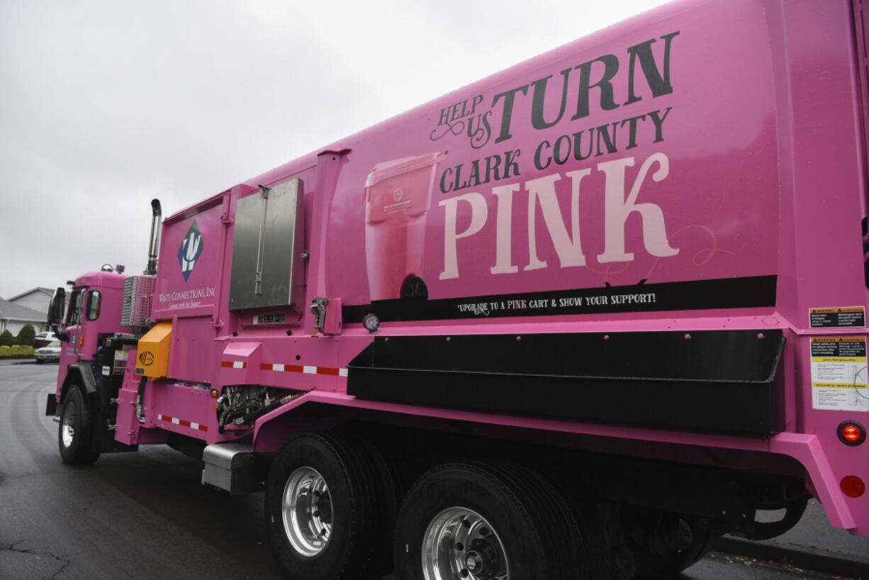 Waste Connections unveiled a pink recycling truck in August to raise awareness about pink recycling carts sold to benefit the local breast cancer nonprofit Pink Lemonade Project. Top: Jarett Hill, a Waste Connections driver, has fliers to distribute to people who ask about the pink recycling truck and carts. Pink recycling carts are available with a $100 donation to the Pink Lemonade Project.