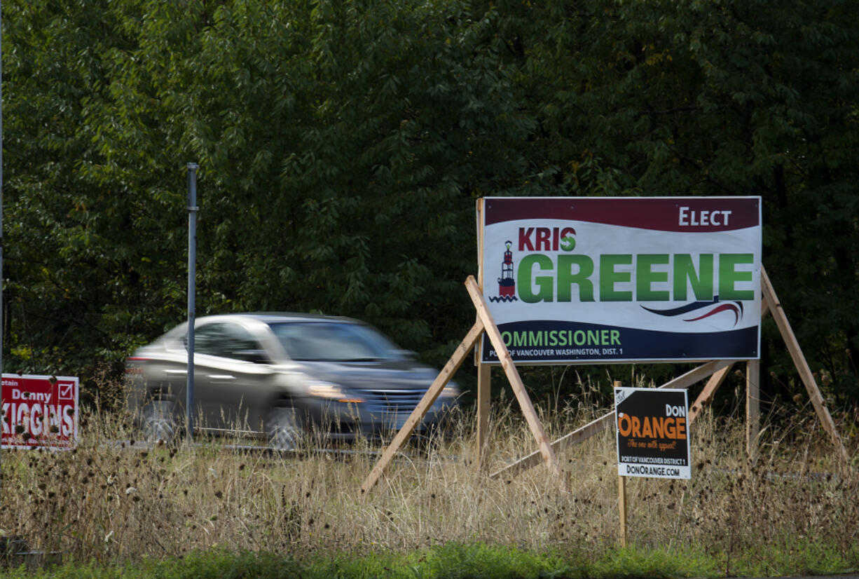 Campaign signs for Port of Vancouver District 1 commission candidates Kris Greene and Don Orange sit at the intersection of Northwest 78th Street and Northwest Lakeshore Avenue. Greene’s former campaign strategist claims energy industry insiders wield a heavy influence in Greene’s election campaign.