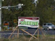 Campaign signs for Port of Vancouver District 1 commission candidates Kris Greene and Don Orange sit at the intersection of Northwest 78th Street and Northwest Lakeshore Avenue. Greene’s former campaign strategist claims energy industry insiders wield a heavy influence in the contentious race.