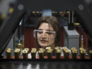 Dana Mals reacts as she learns about hydraulics Saturday in the lab at the Columbia Tech Center in Vancouver. Mals is enrolled in the college’s new Rural Access Mechatronics Program, a hybrid class for students who live in rural parts of Southwest Washington.