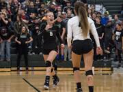 Woodland's Emma Swett (6) celebrates a point during the match at Woodland High School on Tuesday evening, Oct. 17, 2017. Woodland won the match 3-1.