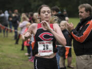 Camas senior Emma Jenkins crosses the finish line taking first in the girlís 4A district cross country championships, Wednesday October 18, 2017, at Lewisville Park in Battle Ground.