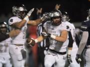 Union's Dustin Nettles (9) and Aiden Nellor (87) react after recovering a Skyview fumble in the first quarter at Kiggins Bowl on Friday night, Oct. 20, 2017.