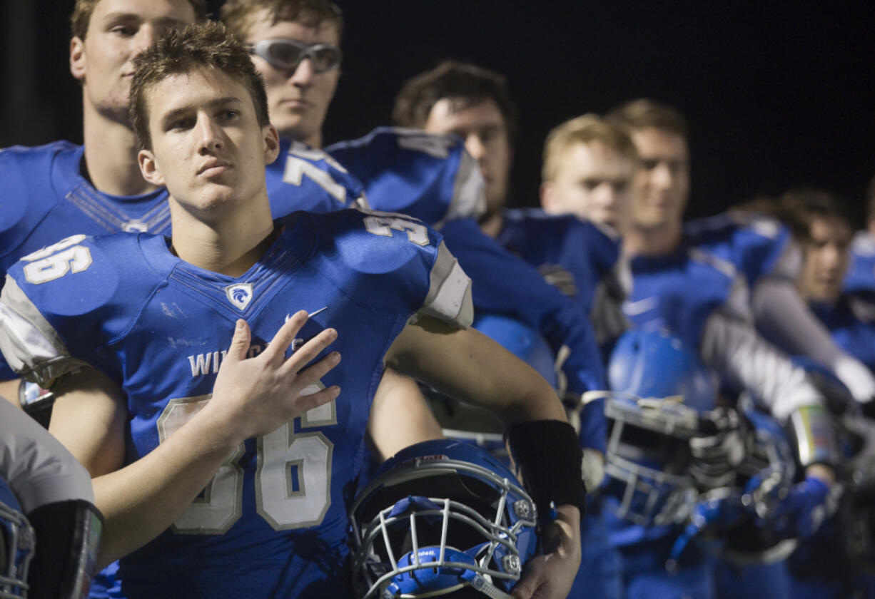 La Center Wildcat Wyatt Dodson during the national anthem at a football game in La Center Friday October 20, 2017.