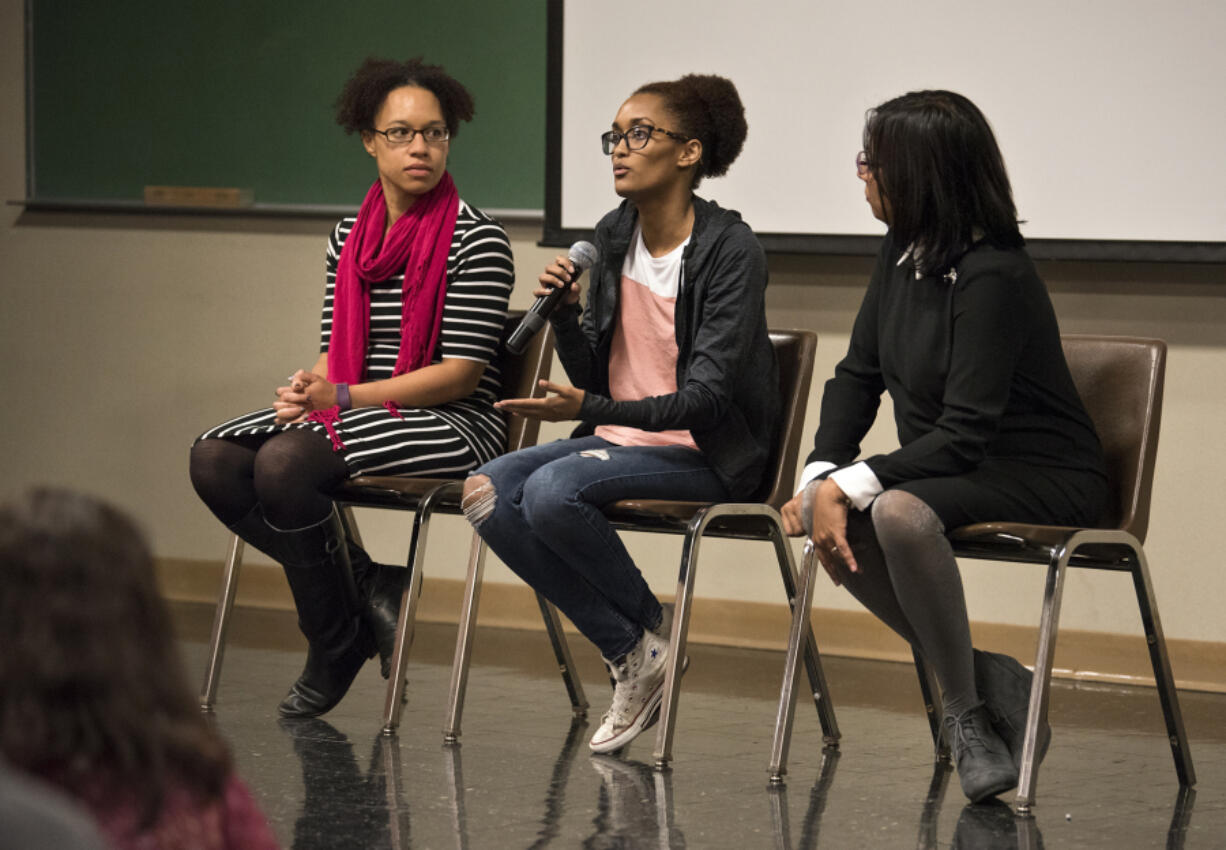 Immigration attorney Mercedes Riggs, left, Nadia Kassa of Vancouver, center, and Zubaida Ula of La Center answer questions Tuesday from the audience during the Indivisible Greater Vancouver immigration forum at Clark College.