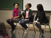 Immigration attorney Mercedes Riggs, left, Nadia Kassa of Vancouver, center, and Zubaida Ula of La Center answer questions Tuesday from the audience during the Indivisible Greater Vancouver immigration forum at Clark College.