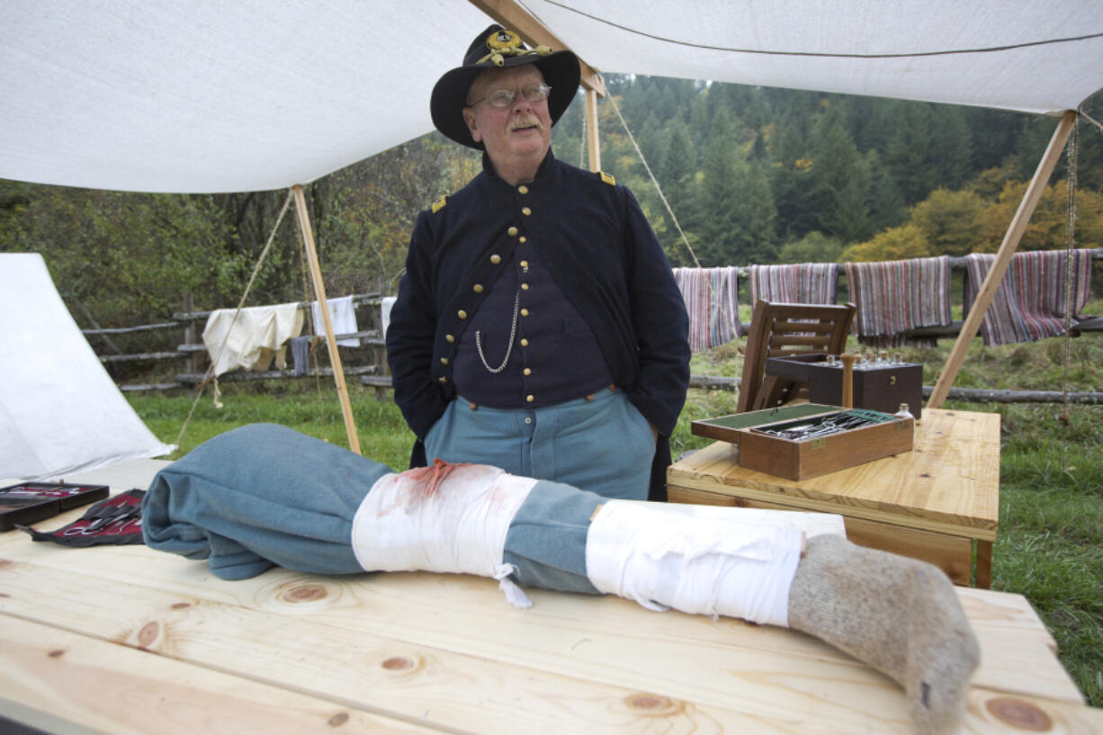 Civil War re-enactor Bob Wetter as an assistant surgeon in a Union Army aid station Sunday at Pomeroy Living History Farm in Yacolt.