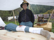 Civil War re-enactor Bob Wetter as an assistant surgeon in a Union Army aid station Sunday at Pomeroy Living History Farm in Yacolt.