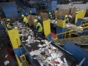 Although workers hand-sort recyclables on conveyor belts at the West Vancouver Materials Recovery Center, some contaminating materials make their way through to the final product.