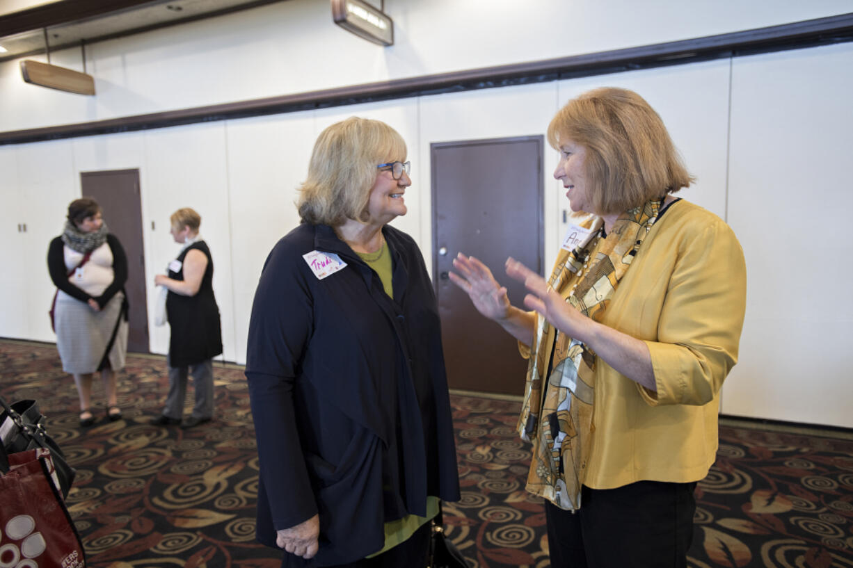 Washington first lady Trudi Inslee, center, chats with Mayor Pro Tem Anne McEnerny-Ogle before speaking to the crowd at the Support for Early Learning and Families Early Learning Summit at WareHouse ’23 on Tuesday morning. Inslee was among the speakers at the event before touring the Clark County Food Bank.